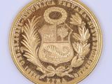 l'image d'une pièce d'or sur laquelle figurent des armoiries
