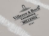 a white plate with a black and white logo on it