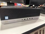 a black and silver hp desktop computer on a desk