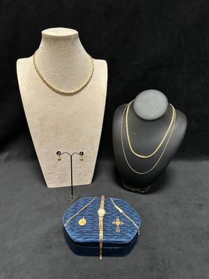 three pieces of jewelry are displayed on a black background