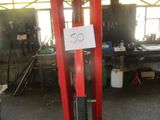 a picture of a fork lift in a garage with a sign on it