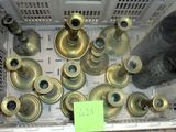 a lot of old brass fire hydrants in a crate