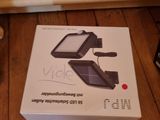 a box that is sitting on the floor next to a phone