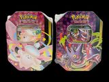 two tins of pokemon trading cards are shown on a black background