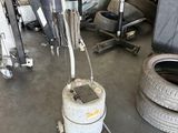 a machine that is sitting on the floor in a garage