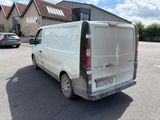 a white van that is parked in a parking lot