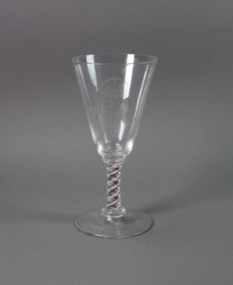 a wine glass that has a spiral design on it