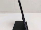 a tablet on a stand with a pen on it