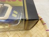 a box with a cell phone inside of it on a table