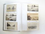an open book with pictures of boats on the water