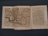 an old book with a drawing of a man on a horse