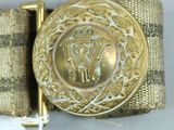 a belt that has a gold buckle on it