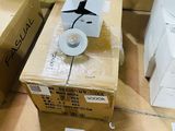 a box with a toilet and a toilet paper dispenser on it