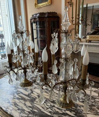 a table with a bunch of crystal candles on it