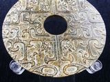 an image of a gold plate with a design on it