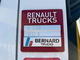 a sign on the side of a white truck that says renault trucks