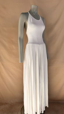 the mannequin is wearing a white dress on a mannequin stand