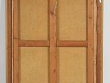 an old wooden frame with a window on the inside of it