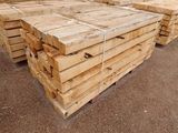 a lot of wooden pallets stacked on top of each other