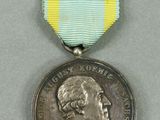 a close up of a medal with a ribbon around it