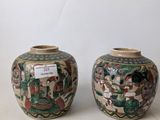 two vases that are sitting on a table