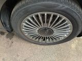 a close up of a tire on a car ' s rim