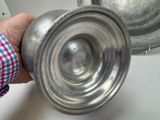 a person holding a metal object in their hand