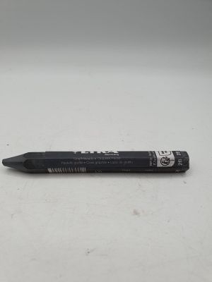 a black pen that is laying on a white surface