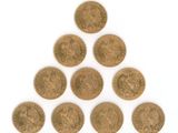 a group of six british coins arranged in a triangle