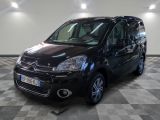 the black van is parked in the garage on a checkered floor