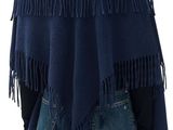 a woman wearing a blue shawl with fringes on it
