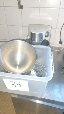 a large metal bowl sitting on top of a kitchen counter