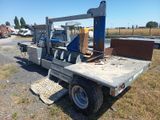 an image of a truck with a crane on it ' s back