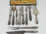 a lot of silverware in a case on the table