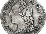 une pièce d'argent portant une tête de femme