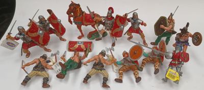 a lot of figurines that are sitting on a table