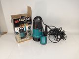 a blue and black vacuum and a box on a white table