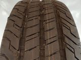 tire tread of a car on a white surface with a white background