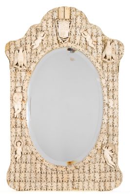 an image of a decorative mirror with a wooden frame and a mirror hanging on the wall