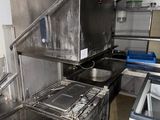 an image of a commercial kitchen with stainless steel appliances