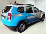 a picture of a blue and white vehicle parked in a garage