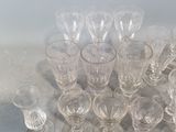 a lot of empty wine glasses sitting on a table