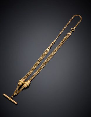 a gold necklace with a bar and a chain