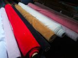 a lot of different colors of fabric on a table