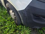 a white van parked on the side of the road