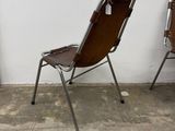 two chairs sitting next to each other in a room