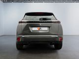 the rear end of a silver suv parked in a garage