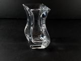 a glass vase that is sitting on a table