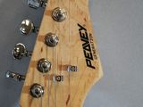 an electric guitar with a wooden neck and a black fret