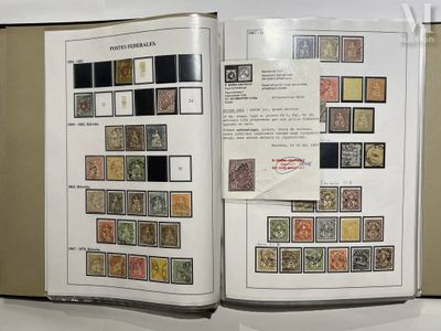an open book with stamps on it sitting on a table
